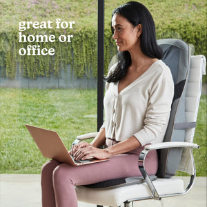 Woman in chair relaxes while enjoying a massage from the Homedics Shiatsu Elite II Massage Cushion with Soothing Heat