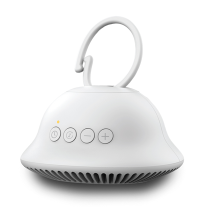 Alternate angle of baby in baby carrier sleeping with Homedics SoundSpa On-The-Go attached