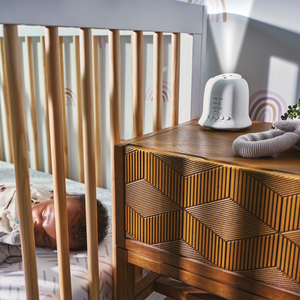 Baby sleeps in crib after enjoying theHomedics SoundSpa® Lullaby with Sounds & Projection