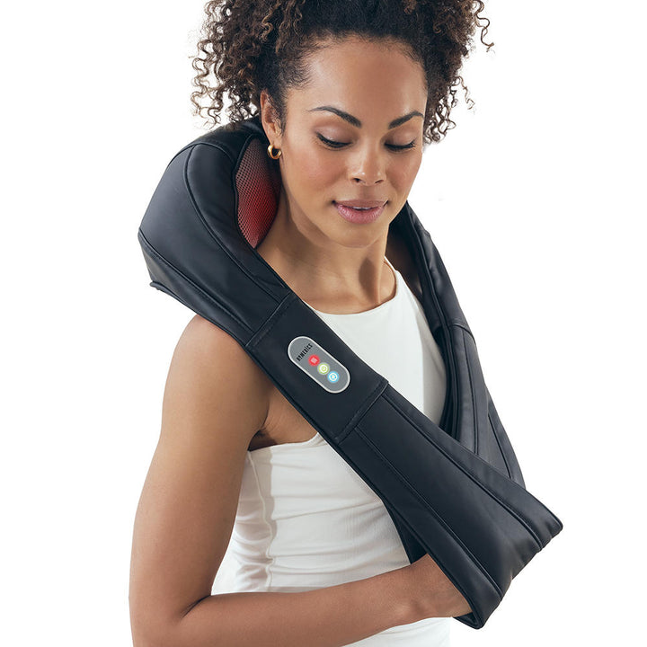 Woman enjoys neck massage from the Homedics Shiatsu Neck and Body Massager with Heat