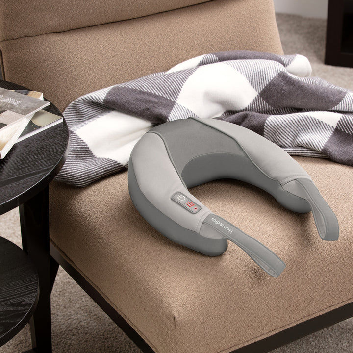 Pro Therapy Vibration Neck Massager with Soothing Heat rests on a chair ready for the next use