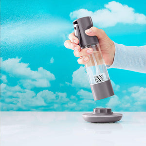 Hand holding the grey Homedics Ozone Clean Multipurpose Cleaner