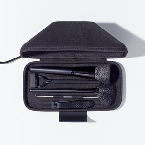 Top-down view of the Homedics UV CLEAN Portable Sanitizer Case with brushes and nail clippers