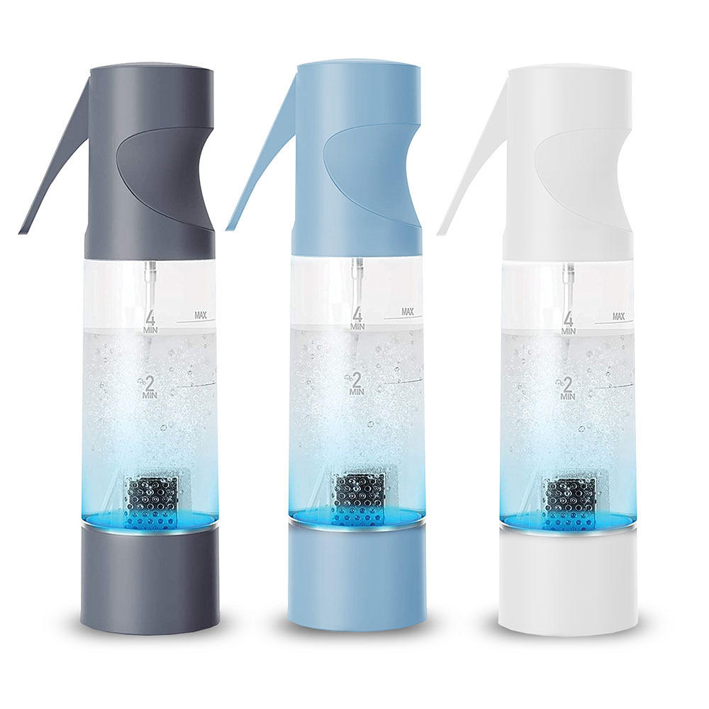 Child sprays strawberry with the Homedics Ozone Clean Multipurpose Cleaner while man watches