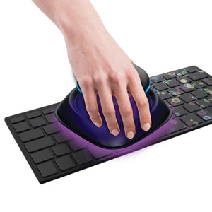 Hand waves UV-Clean Portable Sanitizer Wand over keyboard