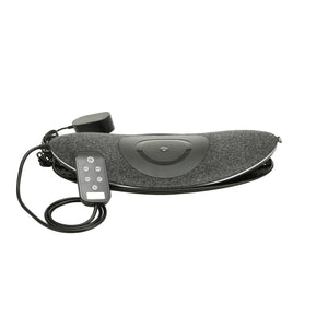 Woman lays on the Homedics Lumbar Lift Lower Back Stretcher and Massager on the floor while enjoying a lower back massage