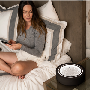 Black | woman winds down in bed while gazing into the drift 11