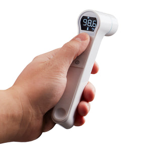 White | Hand holds the white Homedics Infrared Ear and Forehead Thermometer in white