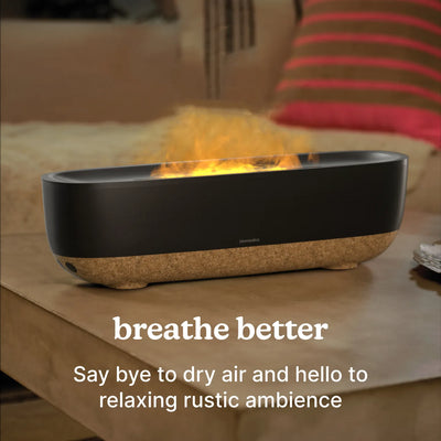 Fireside Ultrasonic Humidifier sits on the coffee table as a center piece while releasing mist into the air