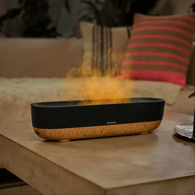 Fireside Ultrasonic Humidifier sits on the coffee table as a center piece while releasing mist into the air