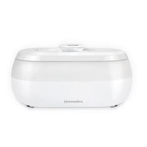 Homedics® Ultrasonic Humidifier CMTF14 releases moisture into her bedroom