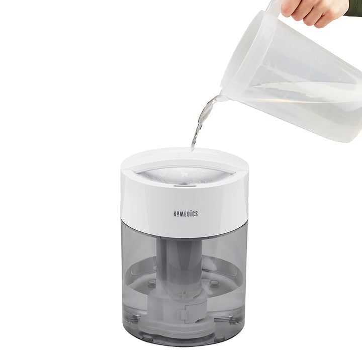 Grey | Water being poured into the top of the Homedics TotalComfort UV-C Ultrasonic Humidifier