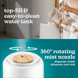 Person fills tank of the Homedics TotalComfort® Deluxe Large Room Ultrasonic Humidifier. Large top-fill tank, up to 70-hour runtime, 1.47-gallon capacity and easy to fill & clean