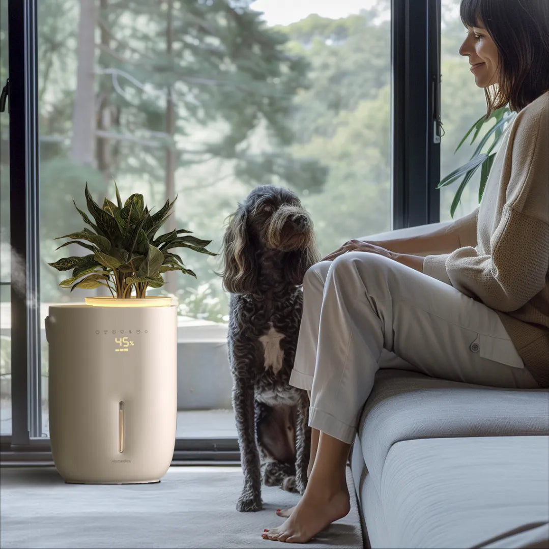 Lifestyle image of a woman and her pet, with the Homedics Small Plant Humidifier enhancing the ambiance of their living space.