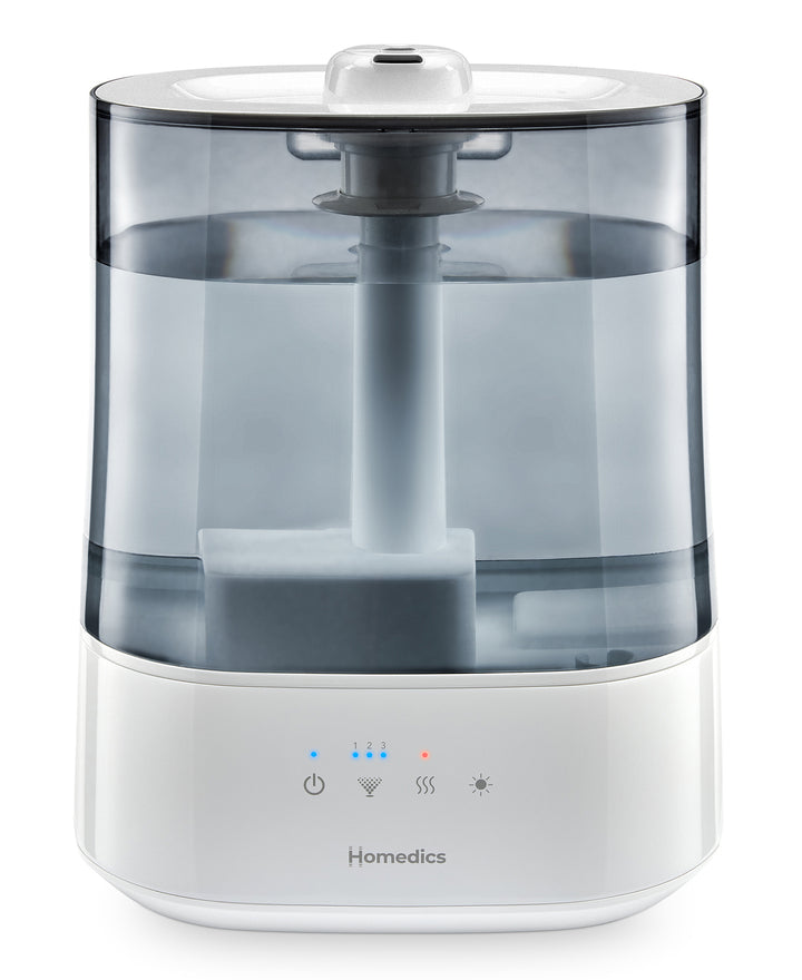 images shows Homedics® Warm/Cool Ultrasonic Humidifier placed in a living room