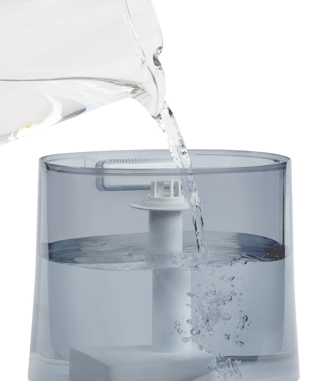 images shows Homedics® Warm/Cool Ultrasonic Humidifier being filled with water from top side
