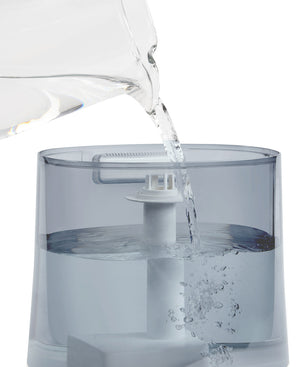images shows Homedics® Warm/Cool Ultrasonic Humidifier being filled with water from top side
