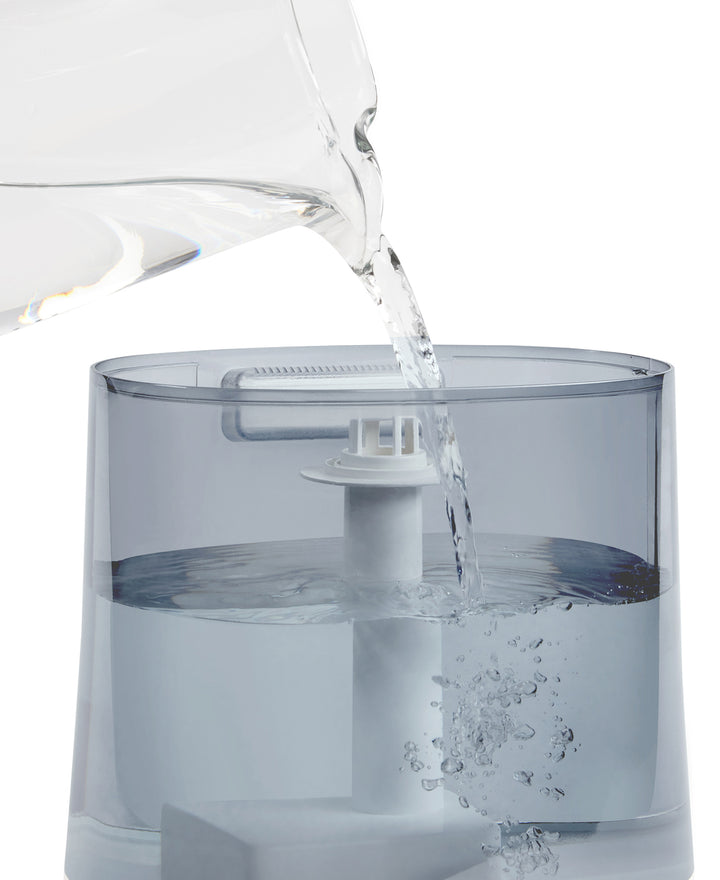 images shows Homedics® Warm/Cool Ultrasonic Humidifier being filled with water from top side