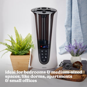 Homedics TotalComfort Deluxe Warm and Cool Mist Ultrasonic Humidifier sitting on table in home