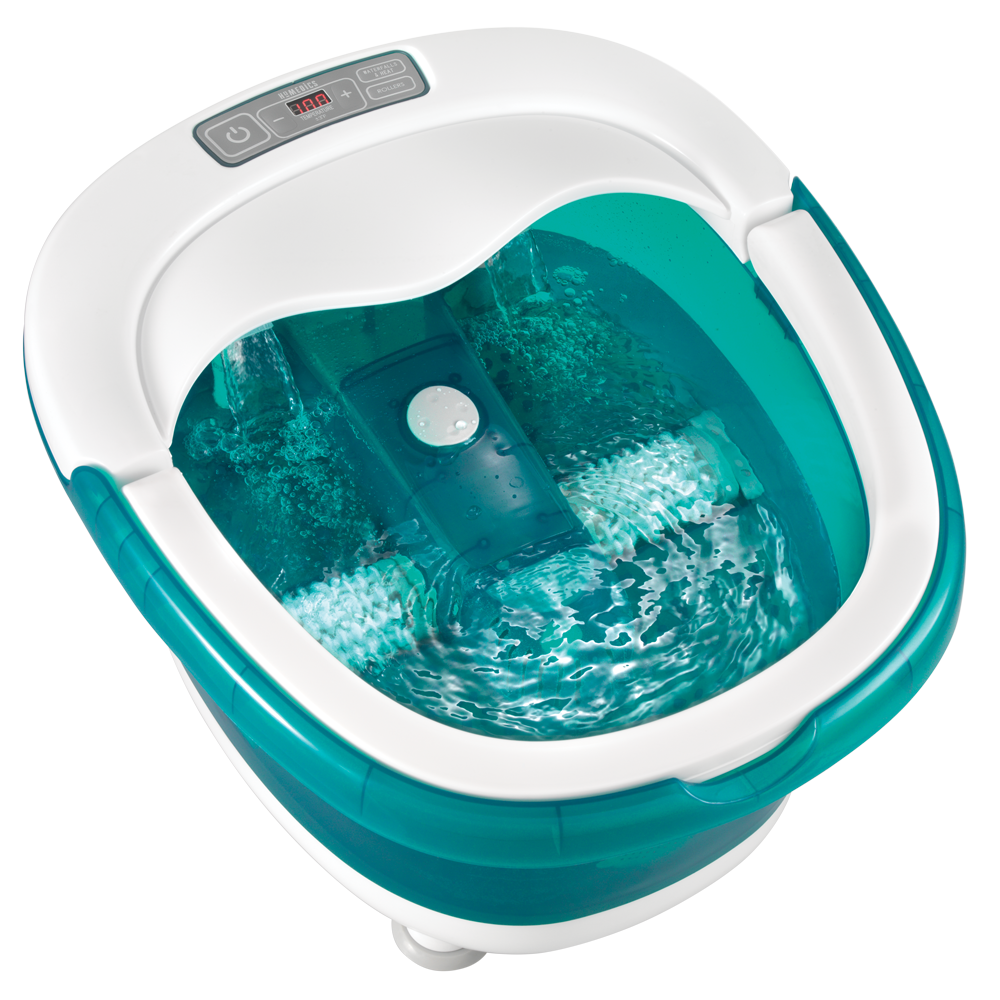 Woman in bath robe sits in chair with feet in the Homedics Deep Soak Duo Footbath with Poweroll Massage