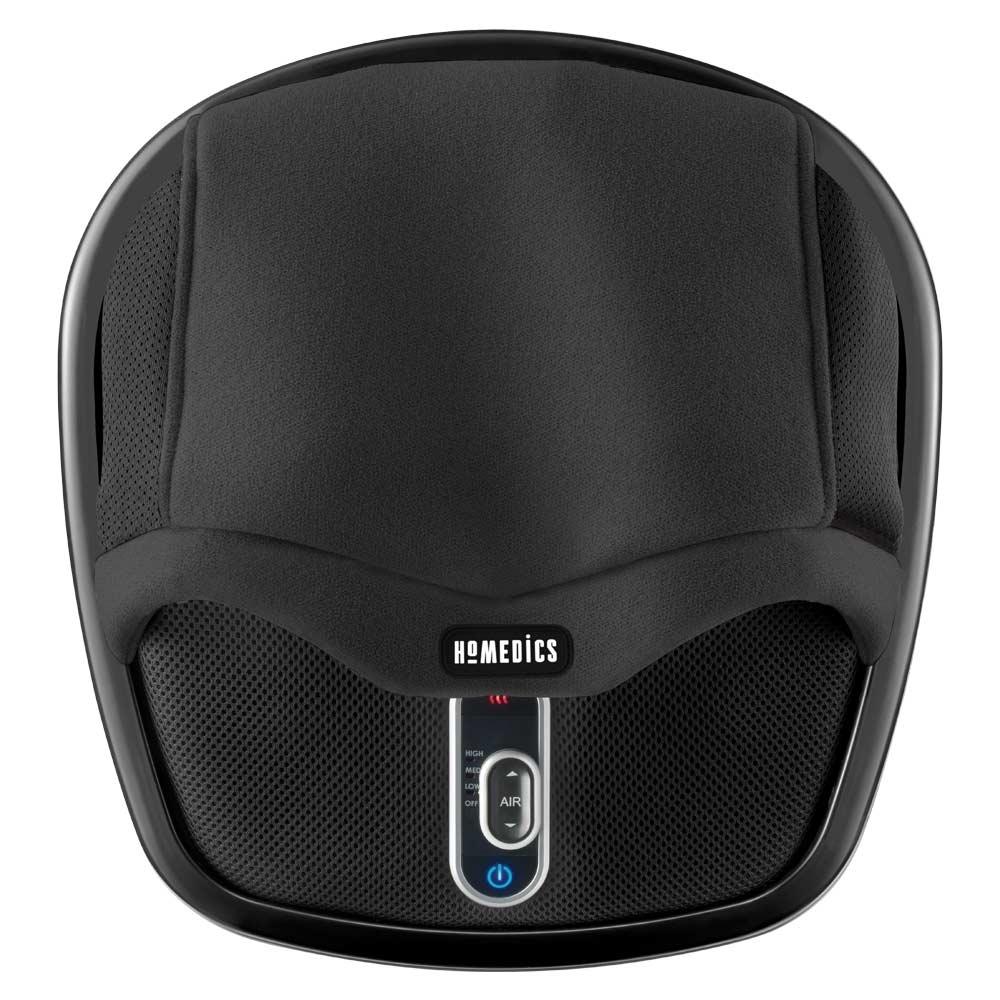 Man sits on couch and enjoys a foot massage from the Homedics Shiatsu Air Max Foot Massager with Heat