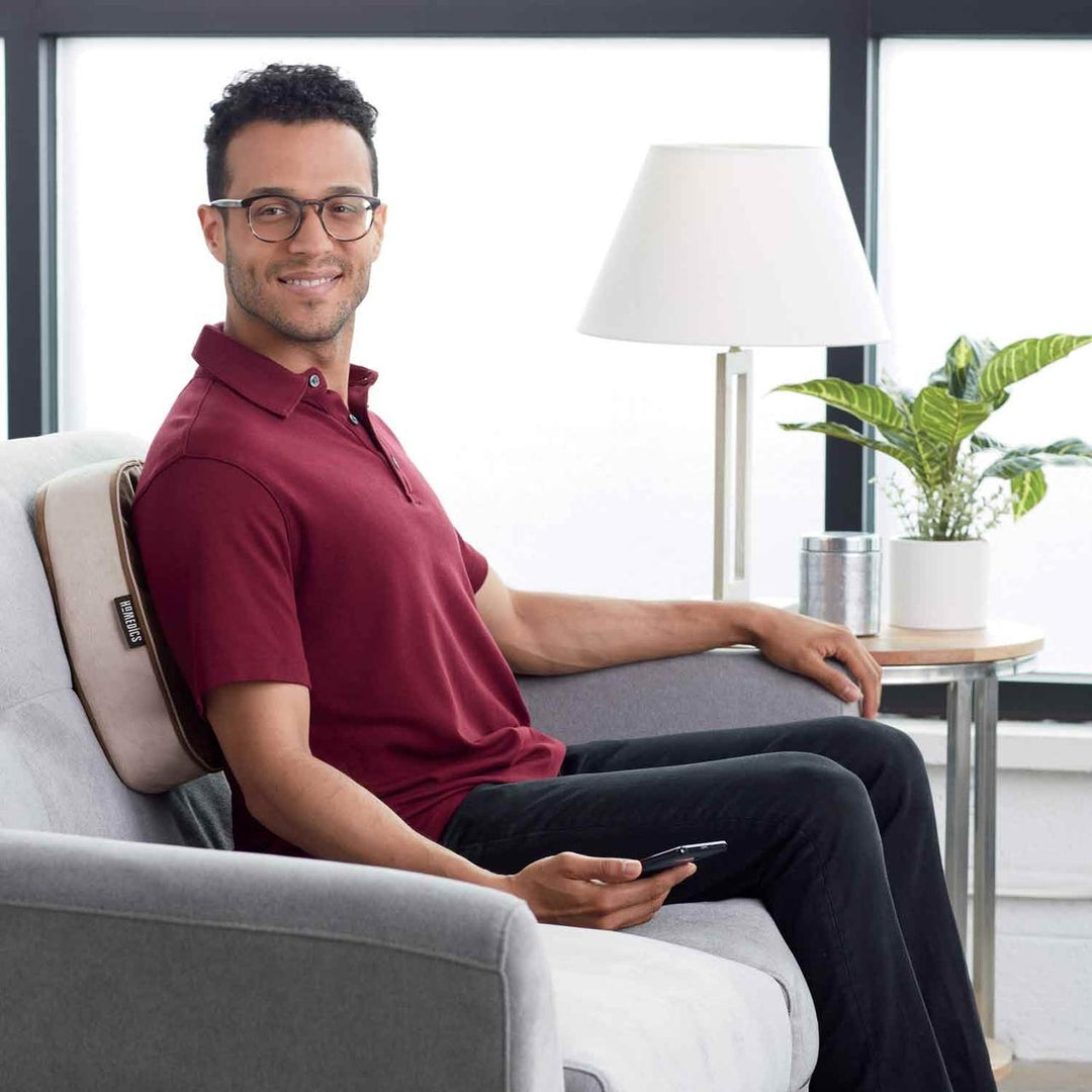 Tan | Man in chair enjoys back massage from the tan Homedics Double Duty Shiatsu Massager with Soothing Heat