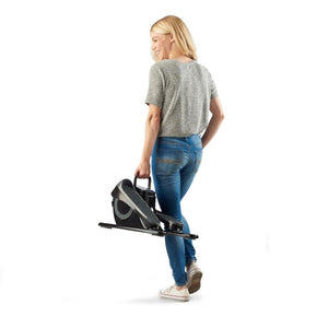 Woman carrying the Homedics Stayfit Mini-Stepper