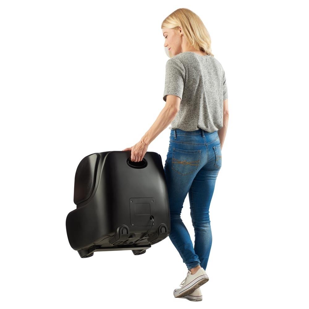 Woman carries the Homedics Therapist Select 2.0 Foot and Calf Massager with Soothing Heat