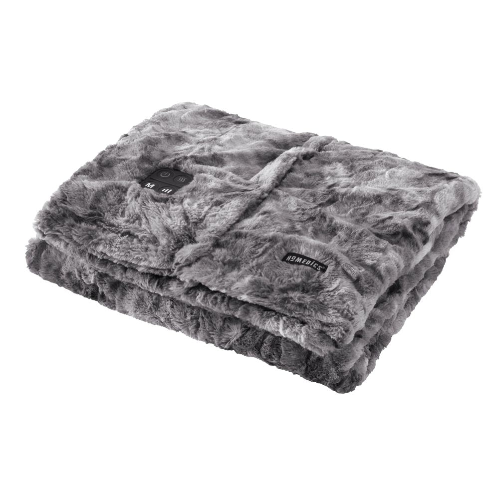 Man relaxes on chair while covered with the Homedics Cordless Throw & Cape with Soothing Heat & Vibrating Massage