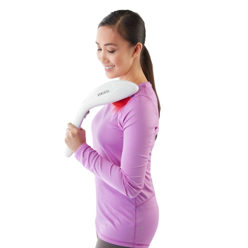 White | Woman enjoys upper chest massage using the Homedics Cordless Percussion Body Massager with Soothing Heat