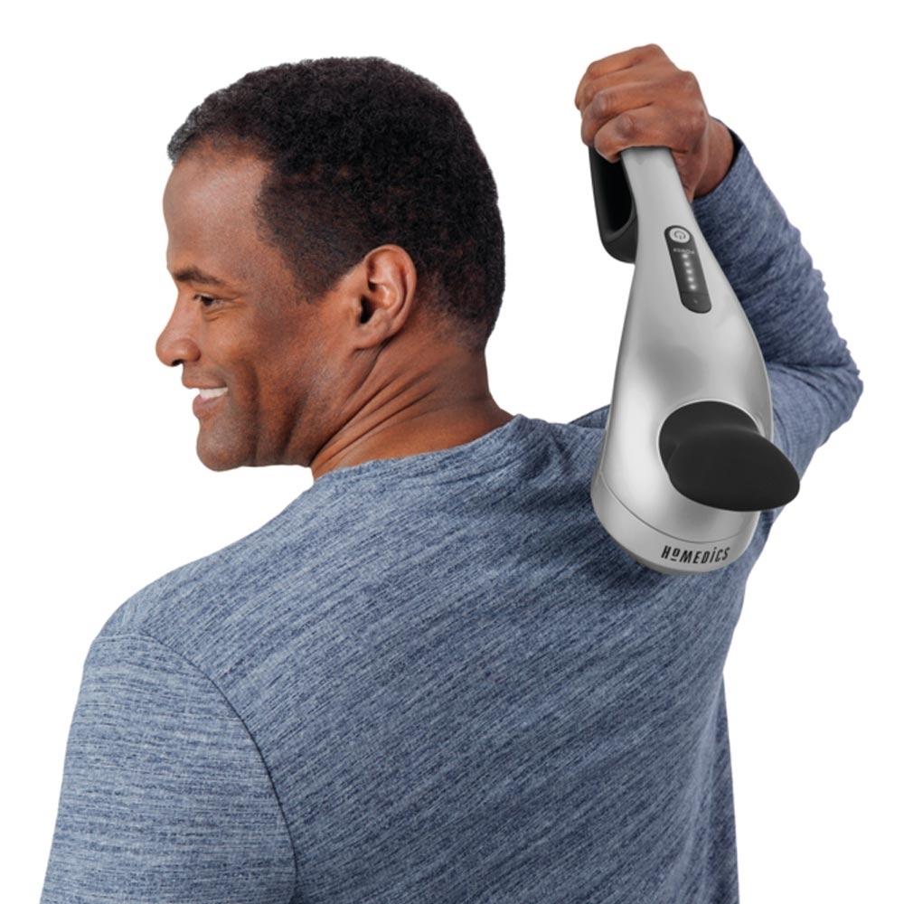 Man holds the Homedics Cordless Pro Performance Percussion Massager up to right upper back