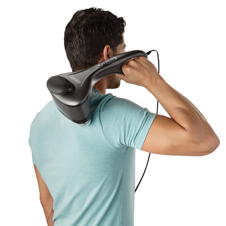 Mah holds Homedics Dual Temp Percussion Pro Hot and Cold Massager on back