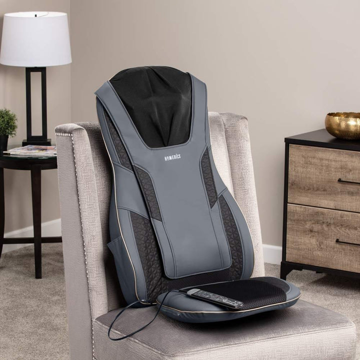 Angled view of the Homedics Serenity Shiatsu Massage Cushion with Sound and Meditation on chair