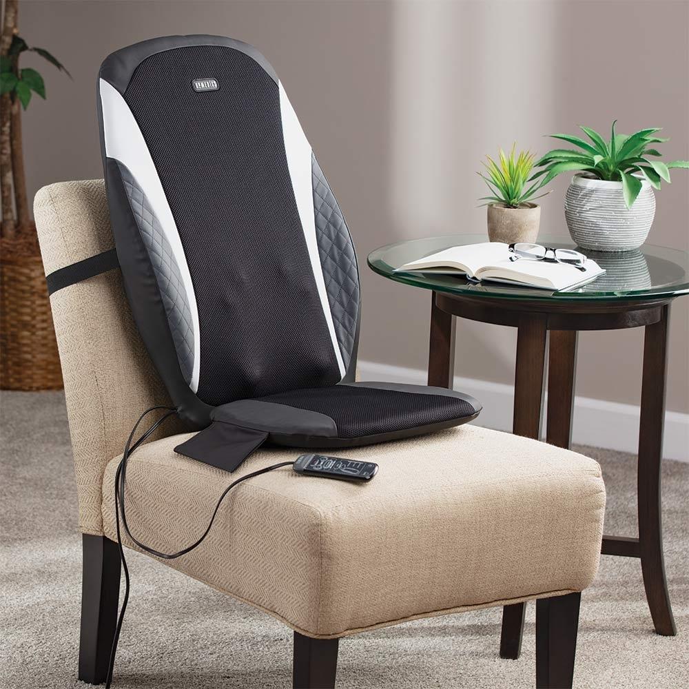 Angled view of the Homedics 8-Node Shiatsu Plus Massage Cushion with Soothing Heat attached to chair