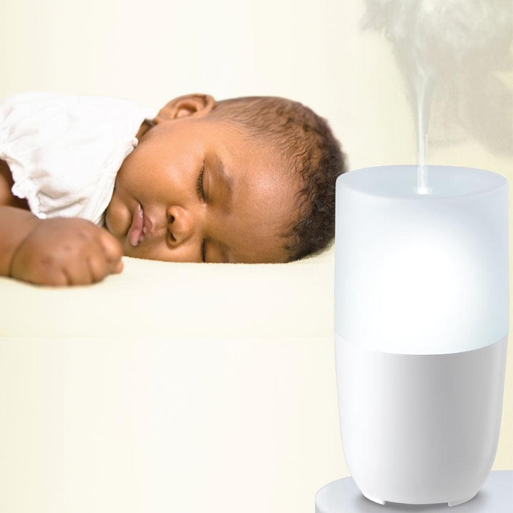 Baby sleeps next to the Homedics MyBaby SlumberScents Aroma Diffuser