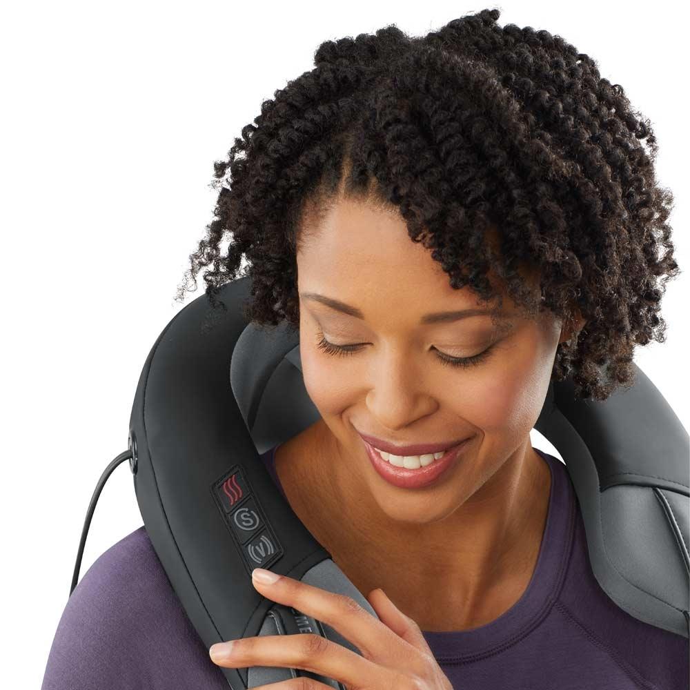 Woman enjoys shoulder massage from theHomedics Pro Therapy Elite - Shiatsu and Vibration Neck Massager with Heat