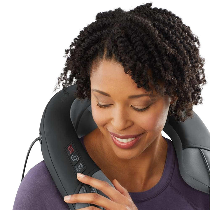 Woman enjoys shoulder massage from theHomedics Pro Therapy Elite - Shiatsu and Vibration Neck Massager with Heat