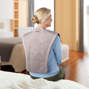 Back view of woman wearing the Homedics Comfort Pro Elite Massaging Vibration Wrap with Heat