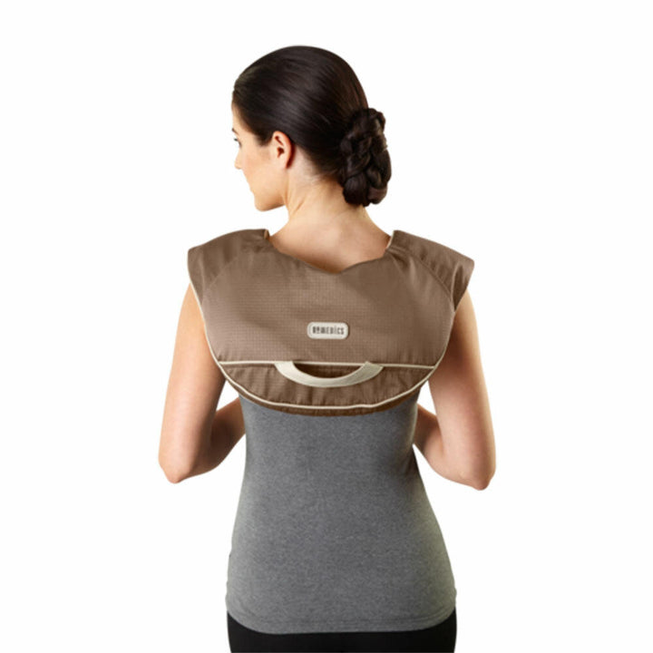 Back view of standing woman enjoys shoulder massage with the Homedics Back and Shoulder Percussion Massager with Heat