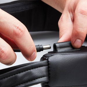 Close-up of the detachable power adapter for the Homedics Cordless Neck and Shoulder Massager with Heat