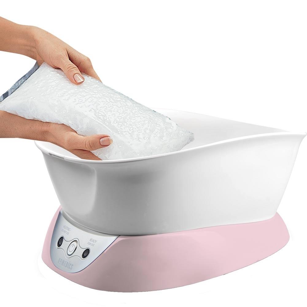 Paraffin wax being added to the Homedics Pink ParaSpa Plus Paraffin Bath