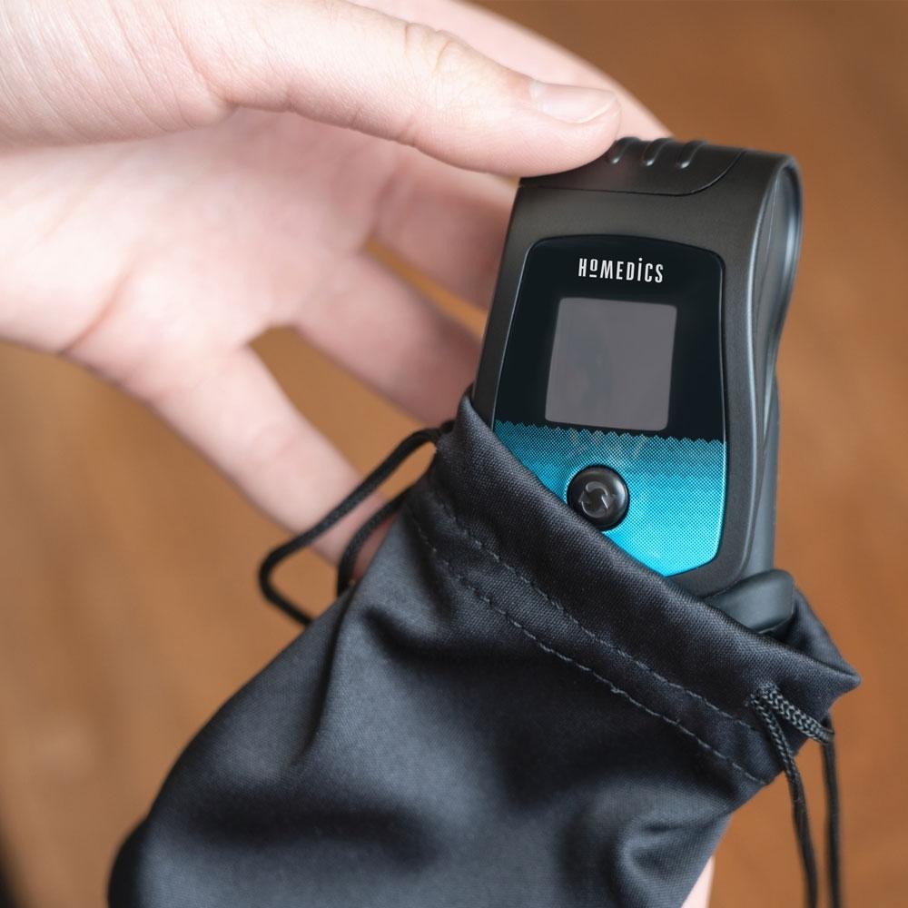 Hand removes Homedics Deluxe Pulse Oximeter from storage bag