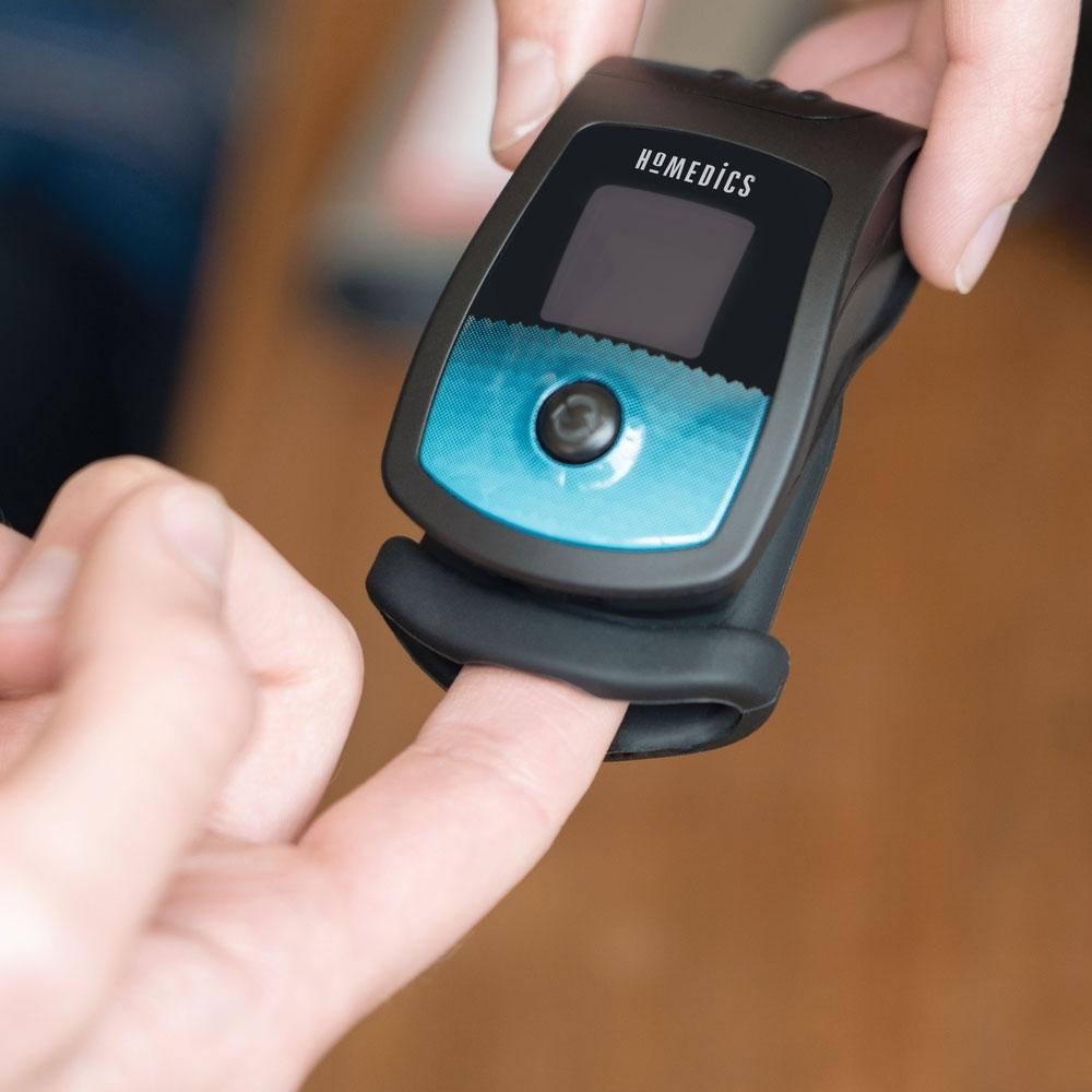 Finger inserted into the Homedics Deluxe Pulse Oximeter