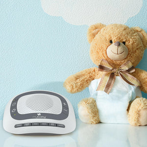 Front view of the Homedics MyBaby SoundSpa Portable next to teddy bear