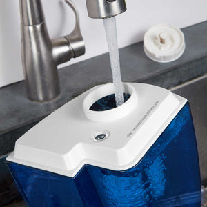 Homedics Total Comfort Ultrasonic Humidifier Warm and Cool Mist water tank being filled in sink