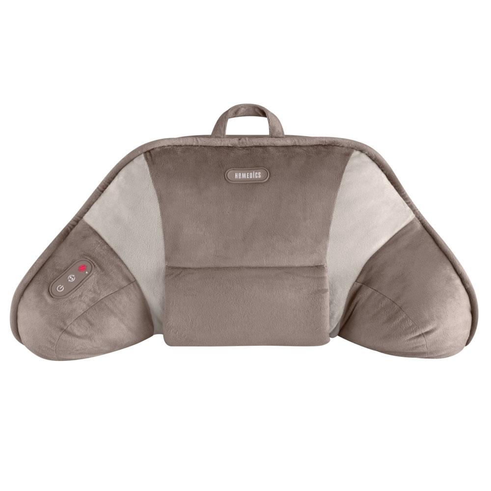 Woman lays in bed enjoying massage from the Homedics Shiatsu Bedrest Plus while reading book