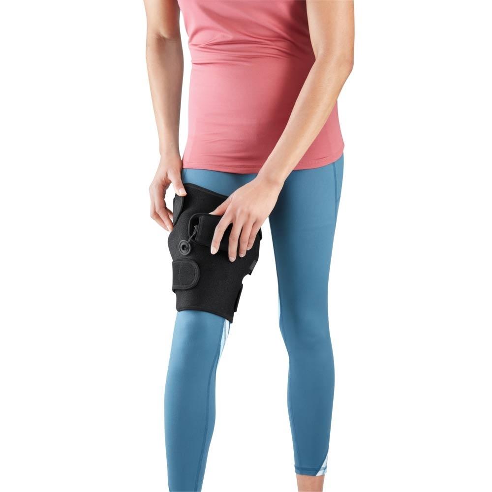 Woman wearing Homedics Cordless Body Wrap with Heat and Vibration on right leg