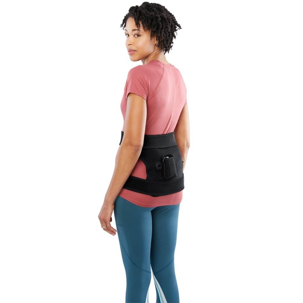 Woman wears the Homedics Cordless Body Wrap with Heat and Vibration on lower back