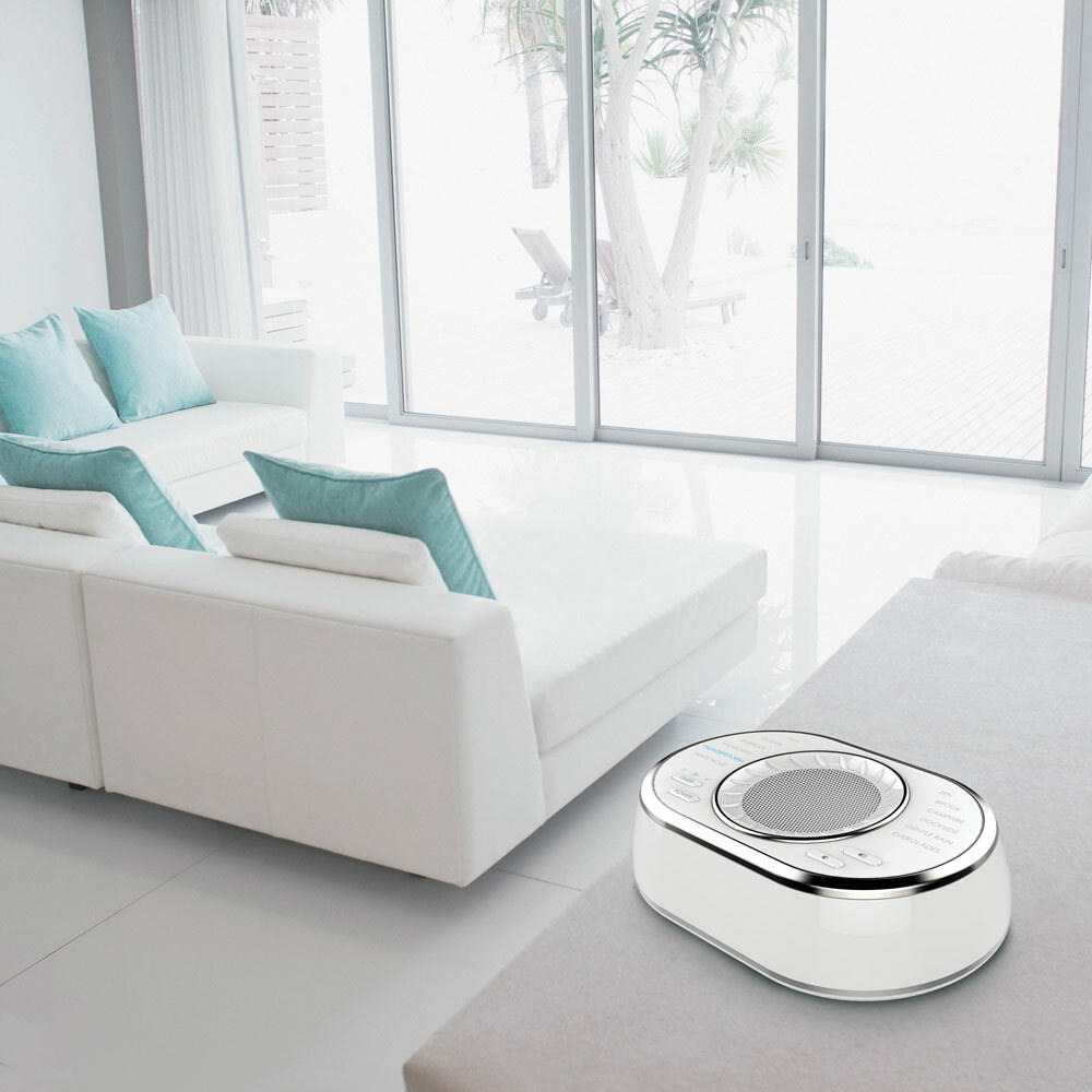 Homedics SoundSpa Ultra Portable Rechargeable Sound Machine on end table near sofa