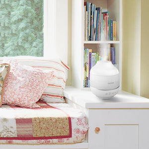 Homedics TotalComfort Cool Mist Ultrasonic Humidifier on night stand next to bed